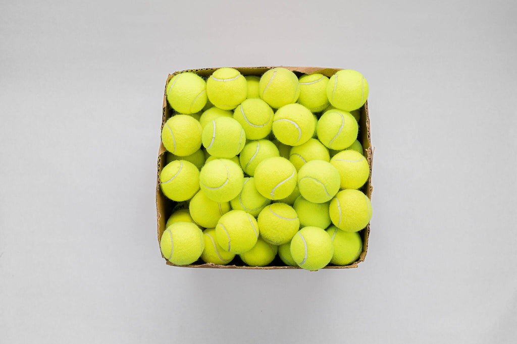 Overhead shot of used tennis balls for sale